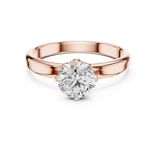 Rose gold ring with a large diamond on a white background