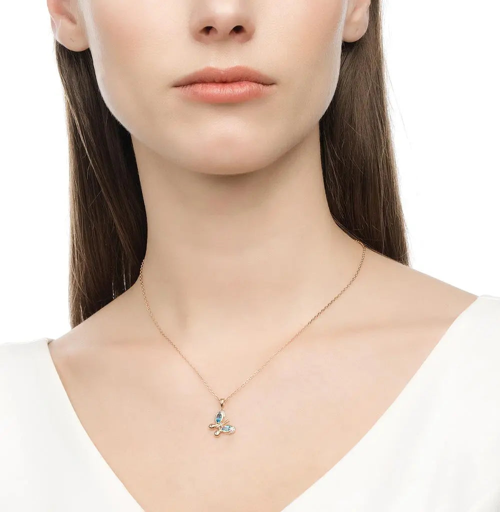 Rose Gold Butterfly pendant necklace with topaz and diamonds - cushionblue