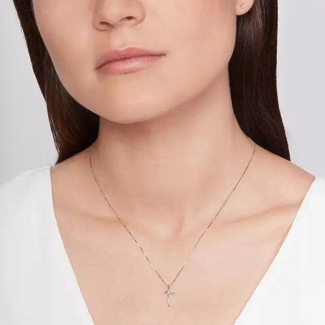 Single Diamond cross pendant in white gold - cushionblue