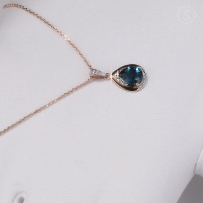 Rose Gold pendant necklace with blue topaz and diamonds